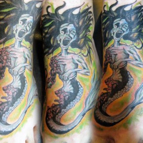 Mermaid in a Manhole tattoo