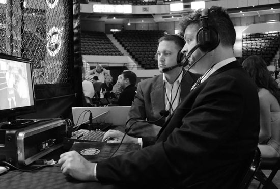Jay (right) commentating at a recent MMA event.
